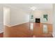Bright living room features hardwood floors and a cozy fireplace at 6724 Long Nook Ln, Indian Trail, NC 28079