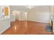Spacious living room with hardwood floors, fireplace, and open floor plan at 6724 Long Nook Ln, Indian Trail, NC 28079