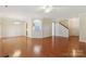 Bright and airy living room with hardwood floors and archways at 6724 Long Nook Ln, Indian Trail, NC 28079