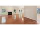 Spacious living room with a fireplace and hardwood floors at 6724 Long Nook Ln, Indian Trail, NC 28079