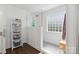 Beautiful bathroom with modern glass shower, subway tile, and a wooden shelf at 7700 Ninth Fairway Ln, Mint Hill, NC 28227