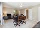 Well-lit bonus room featuring a game table, television, and exercise equipment at 7700 Ninth Fairway Ln, Mint Hill, NC 28227