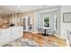 Cozy breakfast nook with hardwood floors, bright windows, and seamless flow to kitchen at 7700 Ninth Fairway Ln, Mint Hill, NC 28227