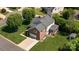 Two-story brick home with a well-kept lawn, an attached garage, and a charming screened-in porch at 7700 Ninth Fairway Ln, Mint Hill, NC 28227