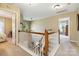 Upstairs hallway showcasing the home's layout and natural light at 7700 Ninth Fairway Ln, Mint Hill, NC 28227