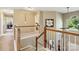 Bright hallway featuring wood banisters, neutral paint, and access to several rooms at 7700 Ninth Fairway Ln, Mint Hill, NC 28227