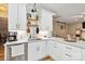 Well-lit kitchen with stainless steel appliances, granite countertops and stylish backsplash at 7700 Ninth Fairway Ln, Mint Hill, NC 28227