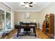 Bright office space with large window, desk, and beautiful hardwood floors at 7700 Ninth Fairway Ln, Mint Hill, NC 28227