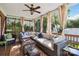 Relaxing screened porch with comfortable seating and serene views at 7700 Ninth Fairway Ln, Mint Hill, NC 28227