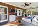 Charming screened porch with brick accents and comfortable seating at 7700 Ninth Fairway Ln, Mint Hill, NC 28227