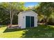 Backyard storage shed with double doors at 7700 Ninth Fairway Ln, Mint Hill, NC 28227