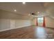 Bonus room with orange curtains, recessed lights, and wood floors at 7740 Freeze Rd, Kannapolis, NC 28081