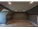 Bonus room with recessed lights, neutral carpet, dark paint and a small built-in desk at 7740 Freeze Rd, Kannapolis, NC 28081