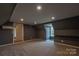 Bonus room with recessed lights, dark paint, neutral carpet, and air conditioning unit at 7740 Freeze Rd, Kannapolis, NC 28081