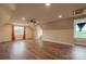 Spacious bonus room with hardwood floors, large windows, and ample natural light at 7740 Freeze Rd, Kannapolis, NC 28081