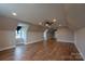 Expansive bonus room with wood flooring, ceiling fan and natural light from a window at 7740 Freeze Rd, Kannapolis, NC 28081