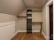 View of closet space with shelving, bars, and wood floors at 7740 Freeze Rd, Kannapolis, NC 28081