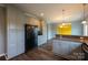 Open dining room and kitchen area showcasing hardwood flooring and ample lighting at 7740 Freeze Rd, Kannapolis, NC 28081