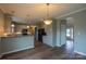 Bright kitchen featuring stainless steel appliances, ample cabinetry, and stylish flooring at 7740 Freeze Rd, Kannapolis, NC 28081