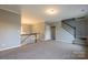 Spacious loft area featuring neutral carpet and staircase leading to the lower level of the home at 7740 Freeze Rd, Kannapolis, NC 28081