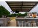 Covered outdoor bar area with seating, ideal for entertaining guests and enjoying the outdoors at 7740 Freeze Rd, Kannapolis, NC 28081