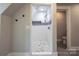 Luxurious shower features tile floor, shower head, and an inset at 7740 Freeze Rd, Kannapolis, NC 28081