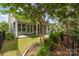 The patio area and backyard landscaping offer a private outdoor living space at 8210 Festival Way, Charlotte, NC 28215