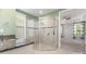 Bright bathroom featuring a glass shower enclosure and a granite countertop vanity at 8210 Festival Way, Charlotte, NC 28215