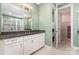 Bathroom featuring granite counters, white cabinets, and a glass-enclosed shower at 8210 Festival Way, Charlotte, NC 28215