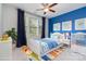 Bright bedroom with a white bed and colorful decor, filled with natural light and ample space at 8210 Festival Way, Charlotte, NC 28215