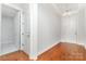 Entryway featuring gleaming hardwood floors and stylish lighting fixtures at 8210 Festival Way, Charlotte, NC 28215