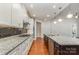 Bright kitchen showcasing granite counters, stainless appliances, and a stylish kitchen island at 8210 Festival Way, Charlotte, NC 28215