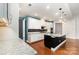 Modern kitchen featuring granite countertops, stainless steel appliances, and ample cabinet space at 8210 Festival Way, Charlotte, NC 28215