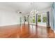 Elegant living space with hardwood floors, stylish light fixtures, and plenty of natural light at 8210 Festival Way, Charlotte, NC 28215