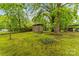 Backyard area featuring mature trees and a storage shed at 93 34Th Street Nw Ct, Hickory, NC 28601