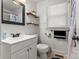 Traditional bathroom features white tiled walls, and updated fixtures and decor at 93 34Th Street Nw Ct, Hickory, NC 28601
