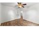 Bedroom featuring modern wood-look floors, white trim and a ceiling fan at 93 34Th Street Nw Ct, Hickory, NC 28601