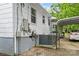 View of side of home with parking area, AC, and utility meter at 93 34Th Street Nw Ct, Hickory, NC 28601