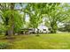 Charming home with a covered parking area, mature trees, and a well-maintained lawn at 93 34Th Street Nw Ct, Hickory, NC 28601