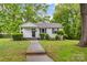 Charming single-story home with a cozy front porch and well-maintained landscaping at 93 34Th Street Nw Ct, Hickory, NC 28601