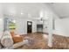 Spacious living area with hardwood floors, natural light, and comfortable seating arrangement at 93 34Th Street Nw Ct, Hickory, NC 28601