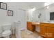 Bathroom featuring double vanity, and decorative mirror at 9588 Marquette Nw St, Concord, NC 28027