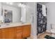 Bright bathroom featuring double sinks, wooden cabinets, and a shower with a unique black shower curtain at 9588 Marquette Nw St, Concord, NC 28027