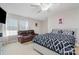 Bright bedroom offers hardwood floors, seating area, and natural light at 9588 Marquette Nw St, Concord, NC 28027