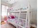 Charming bedroom with bunk beds, soft pink accents, and natural light from the window at 9588 Marquette Nw St, Concord, NC 28027