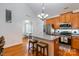 Cozy kitchen includes island, stainless steel appliances, light wood cabinets and adjoins a dining area at 9588 Marquette Nw St, Concord, NC 28027