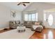 Inviting living room features vaulted ceilings, hardwood floors, a plush sectional couch, and a neutral palette at 9588 Marquette Nw St, Concord, NC 28027