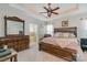 Well appointed main bedroom features tray ceilings, ceiling fan, ensuite access and neutral decor at 9588 Marquette Nw St, Concord, NC 28027