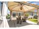 Cozy covered patio with comfortable seating, providing a relaxing outdoor space overlooking the backyard at 9588 Marquette Nw St, Concord, NC 28027