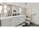 This stylish bathroom has a double vanity and sleek black and white color scheme at 1001 Medinah Ct, Waxhaw, NC 28173